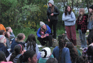 Amy and Guitar Singing and playing guitar while leading a outdoor education program