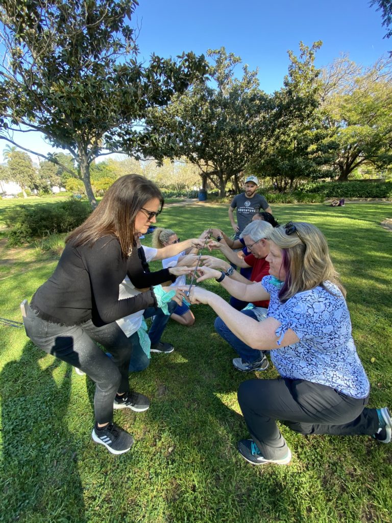 Corporate team building participating in Field Olympics
